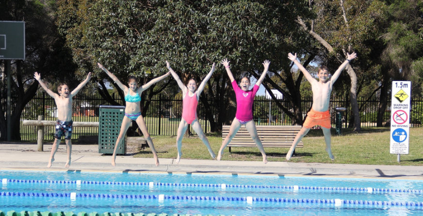 Five children star jumping into outdoor pool